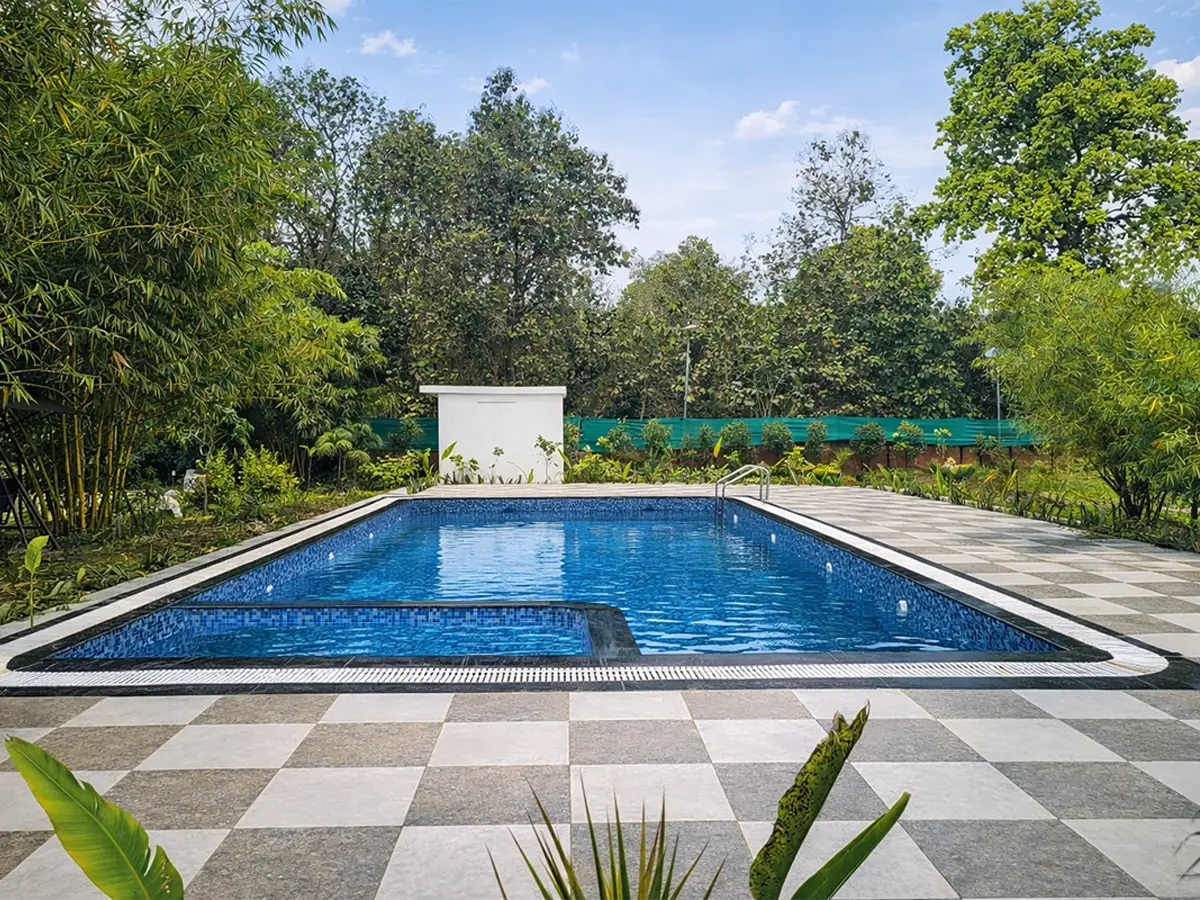 Large swimming pool at Serai The Baagh nature retreat near Kishanpur Wildlife Sanctuary UP